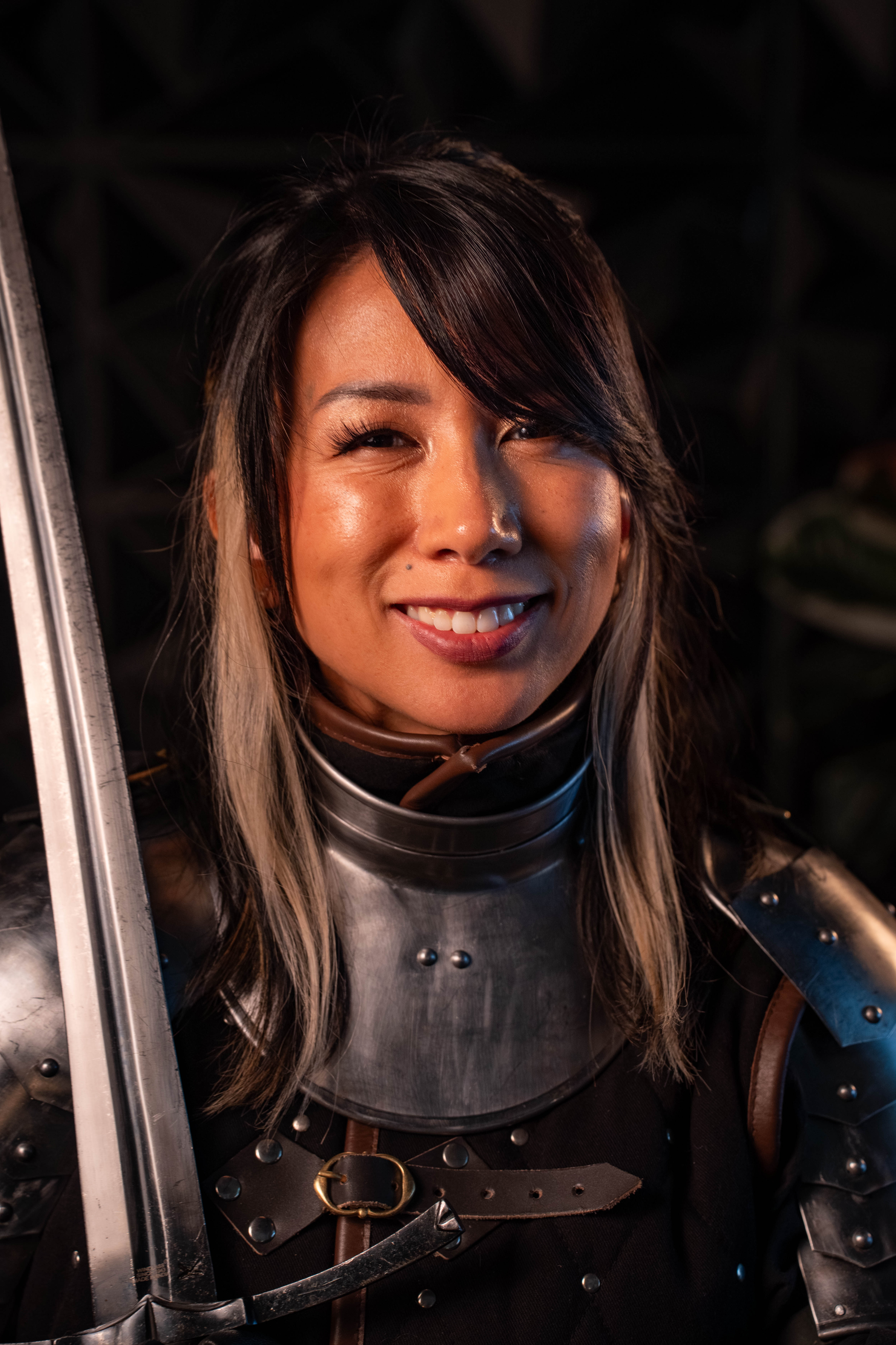 Erika Rosefall — smiling portrait, dark armor