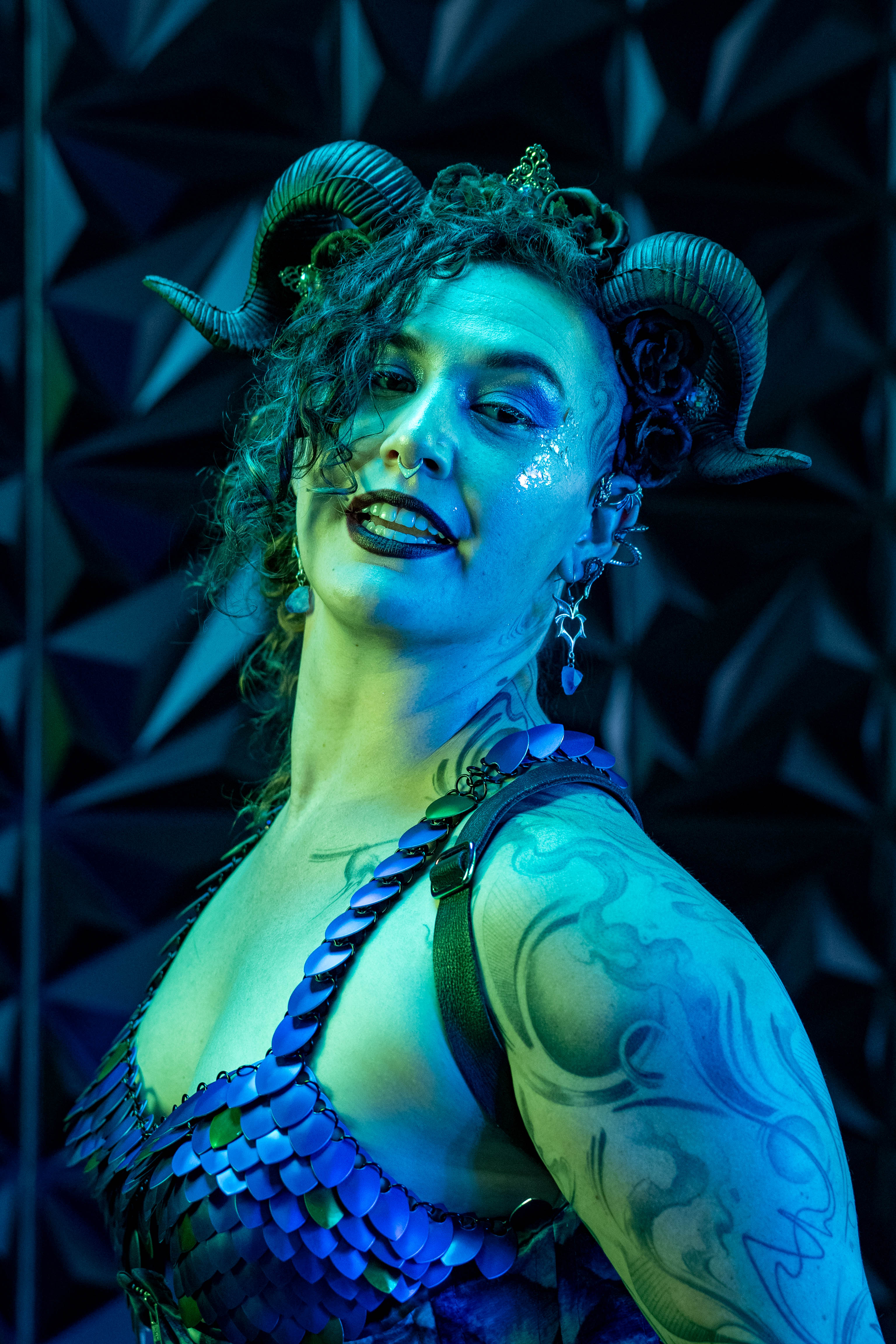 Esjay Powell — close-up blue-lit portrait