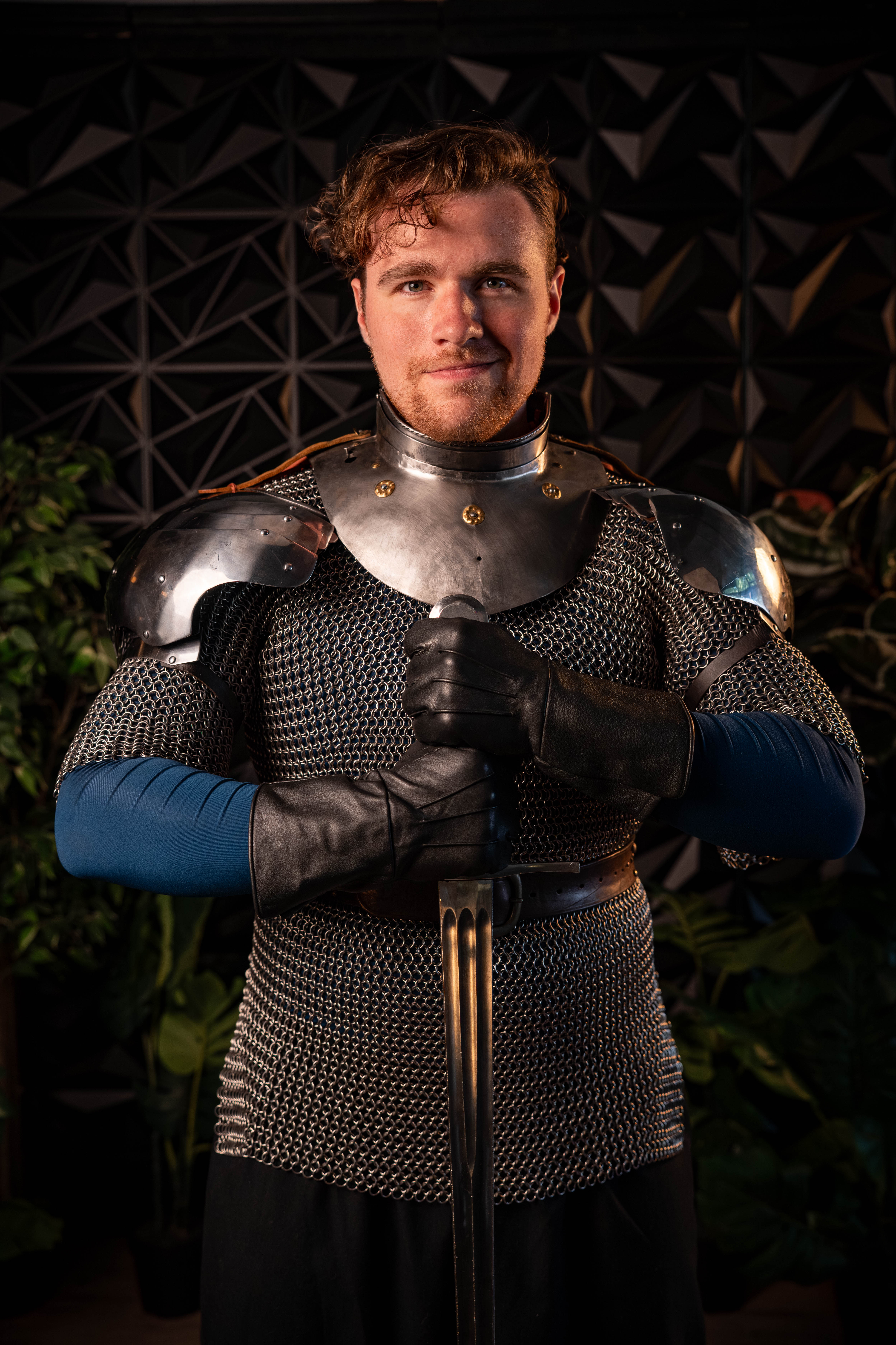 Drew Hearthfire — armored performer portrait